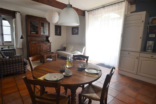 dining, sitting and sleeping area of gite manseng Le Manoir Souillac