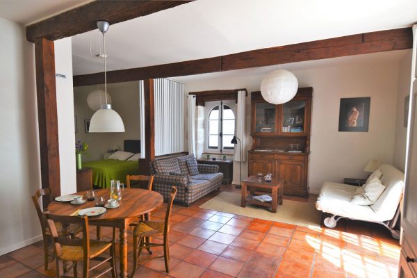 seating, sleeping and dining area of the guest room manseng Le Manoir Souillac