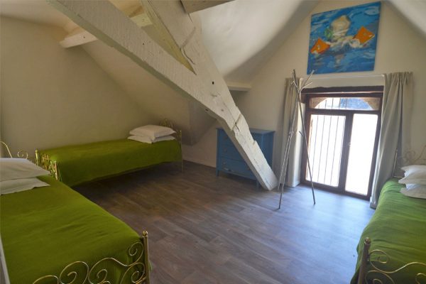 Schlafzimmer mit 3 Einzelbetten Ferienhaus Malbec Le Manoir Souillac